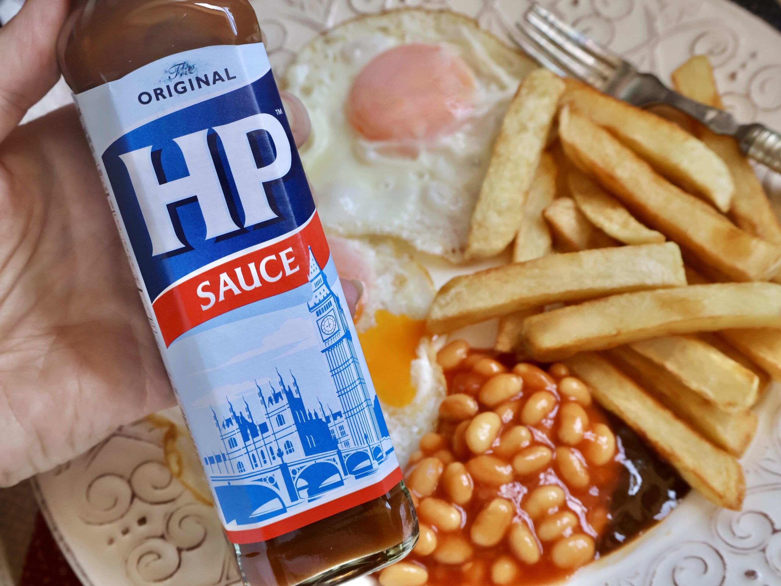 HP Sauce with eggs, beans and chips