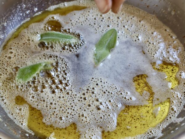 adding sage leaves to brown butter