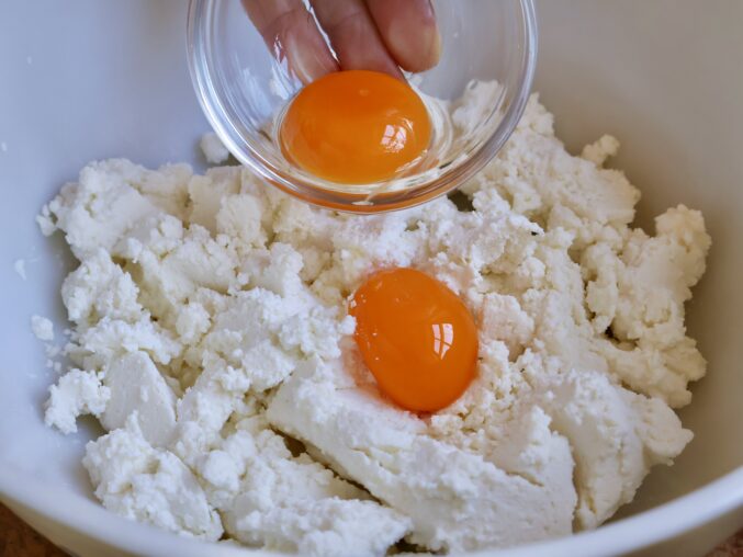 adding yolks to ricotta