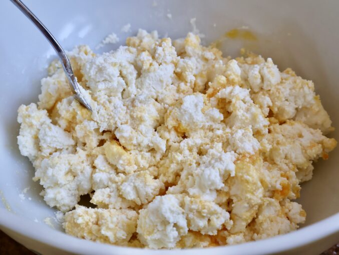 incorporating the egg yolks into the ricotta