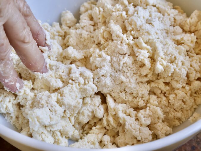 hands mixing dough