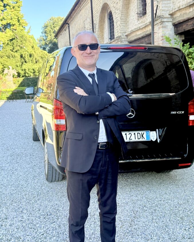 Gianni in front of the van