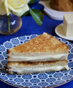 mozzarella grilled cheese on a blue plate