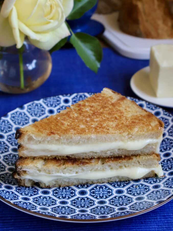 mozzarella grilled cheese on a blue plate