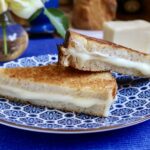 mozzarella grilled cheese on a blue plate