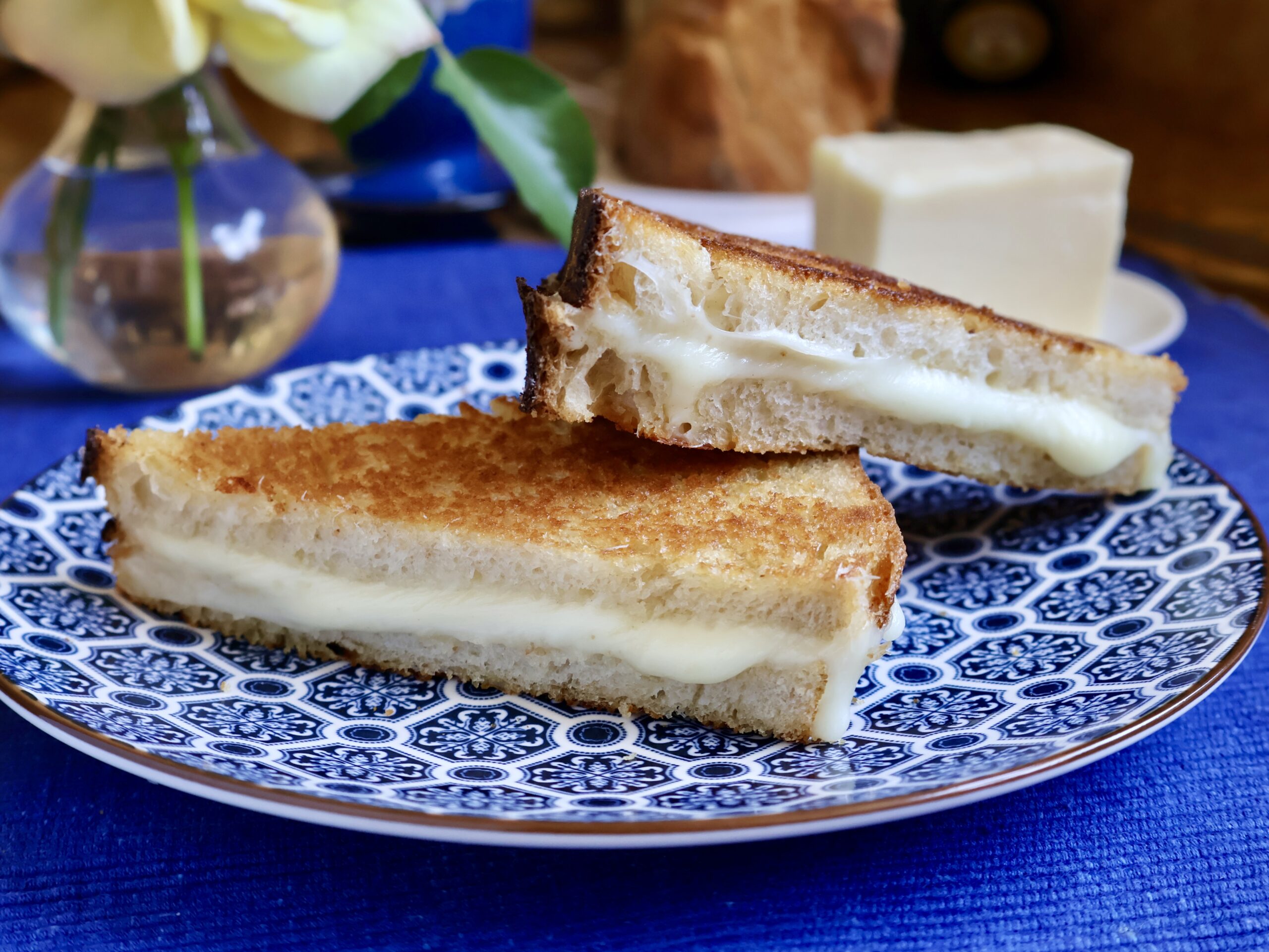 mozzarella grilled cheese on a blue plate