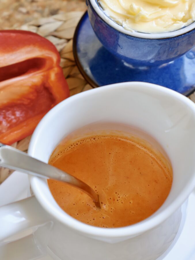 red bell pepper sauce in a jug