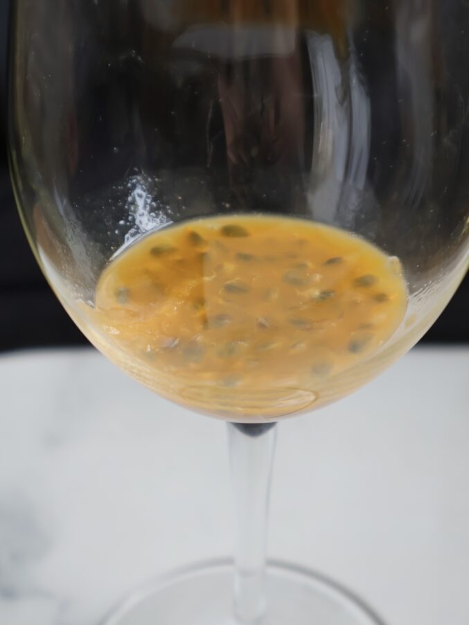 making a passion fruit spritz