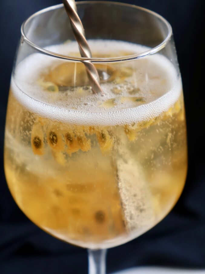 stirring the passionfruit bellini