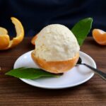 serving tangerine ice cream