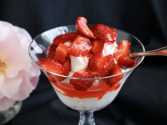 strawberries and dessert cream in a glass