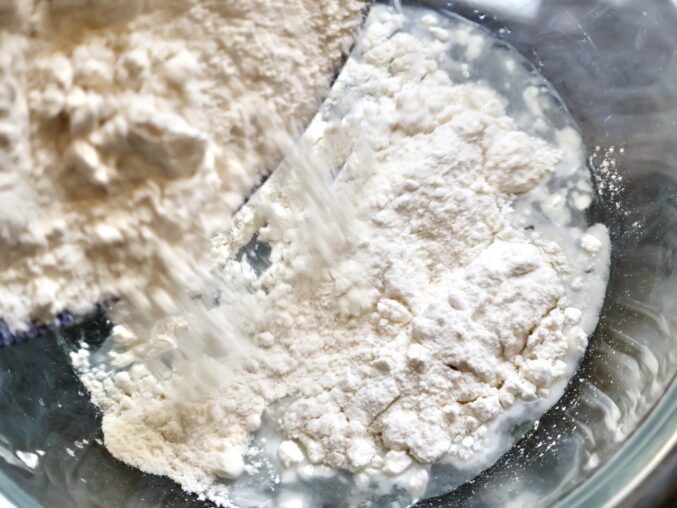 adding flour to water for poolish