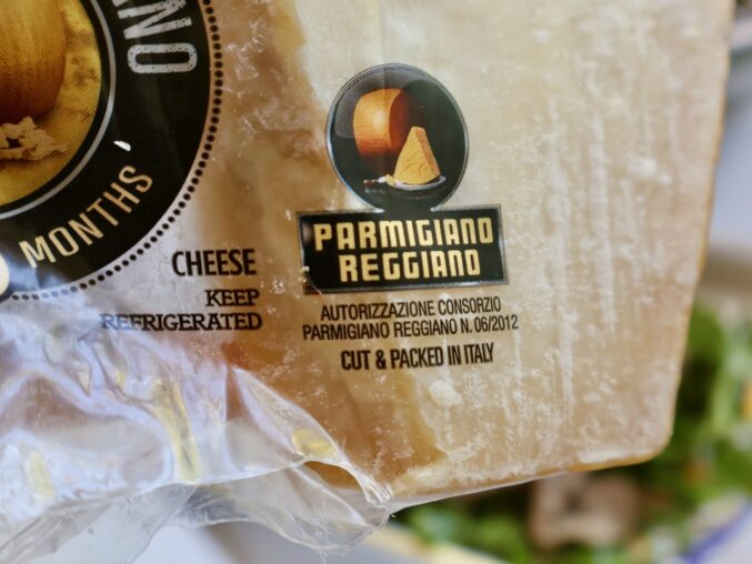 parmigiano reggiano logo on cheese