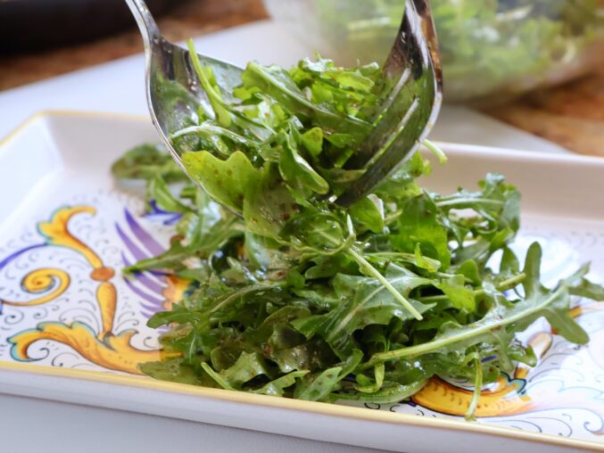 Serving the arugula salad