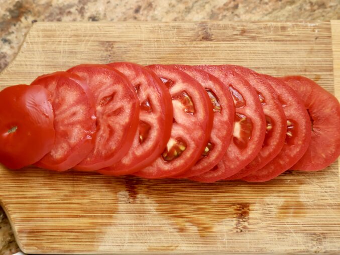 slices of tomato on cutting board